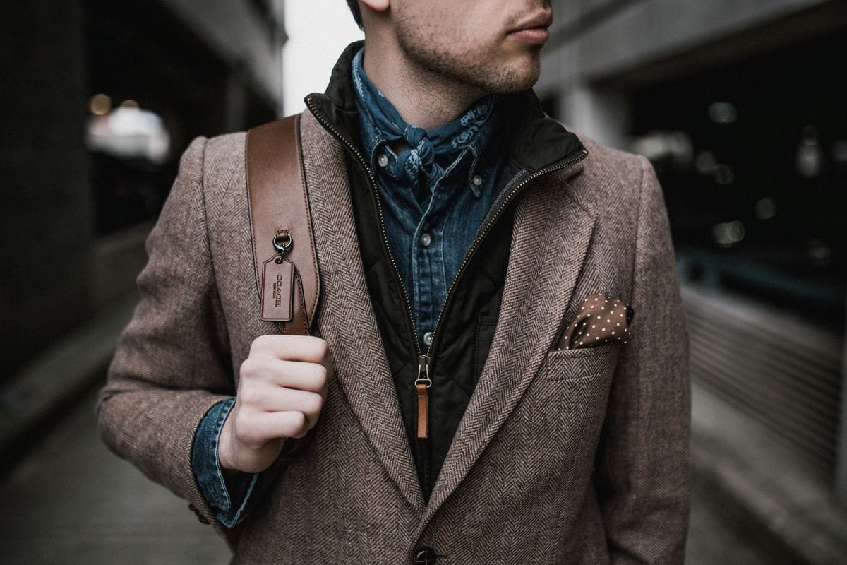 man in brown suit jacket - most worn perfumes