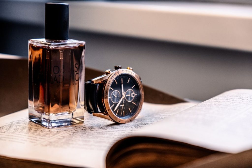 most worn perfumes of 2022 - perfume bottle and watch