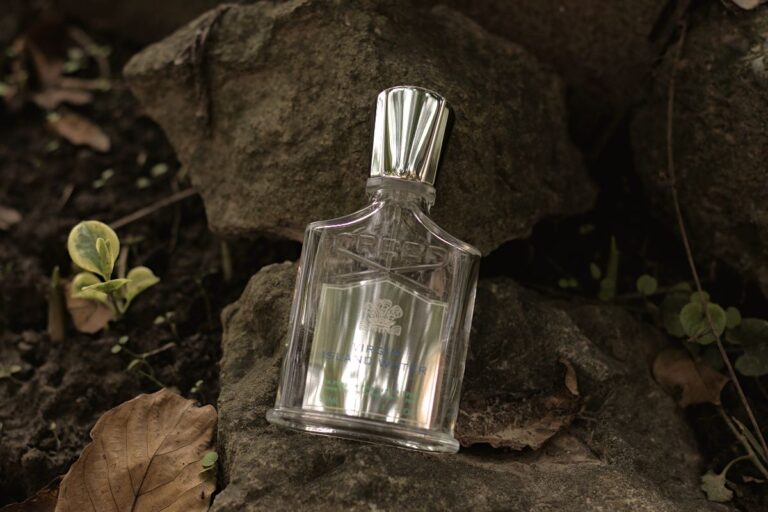 Creed Virgin Island Water bottle on a rock Creed Virgin Island Water Review (2024): Easy Summer Choice Creed Virgin Island Water - bottle on a rock